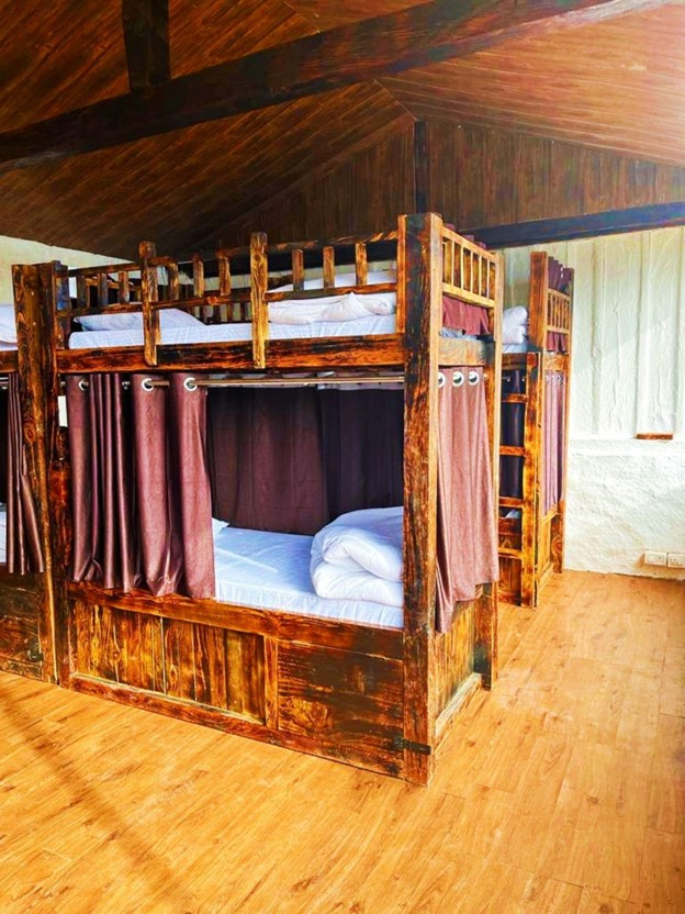 Parvati's Lap Hostel and Villa parvati valley, kasol, Himalayas - Bright wooden interiors and sloped ceiling create an airy, comfortable atmosphere despite the larger capacity. Ideal for group tours, student trips, and backpacking communities in Himachal Pradesh.