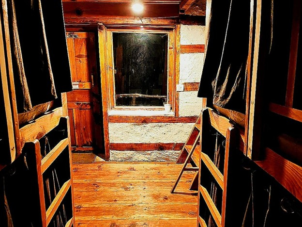 Parvati's Lap Hostel and Villa parvati valley, kasol, Himalayas - Large windows and balcony access provide panoramic valley views. This makes it one of the best balcony dorm rooms near Kasol for travelers who want mountain scenery at budget prices.