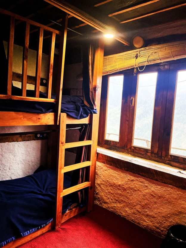 Parvati's Lap Hostel and Villa parvati valley, kasol, Himalayas - Warm lighting and natural textures create a calm and relaxed environment for backpackers staying near Kasol and Tosh.