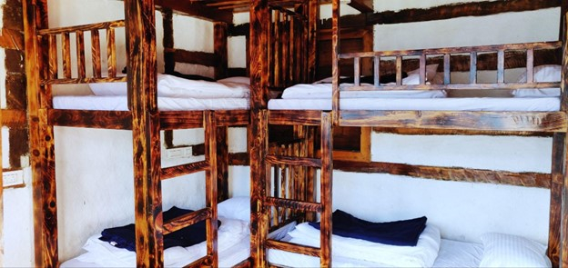 Parvati's Lap Hostel and Villa parvati valley, kasol, Himalayas - Bunk beds with curtains provide privacy and comfort, making this room suitable for solo travelers and backpackers visiting Parvati Valley.